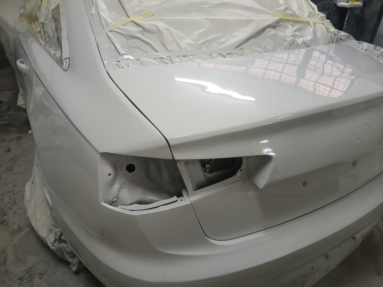 Audi rear boot lid and quarter panel in white primer during respray preparation at Mega Body Auto Cape Town