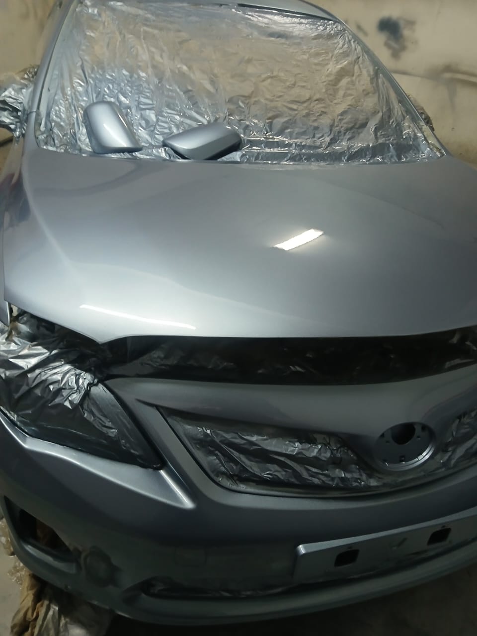 Toyota Corolla front-end panel beating and silver metallic respray at Mega Body Auto Maitland